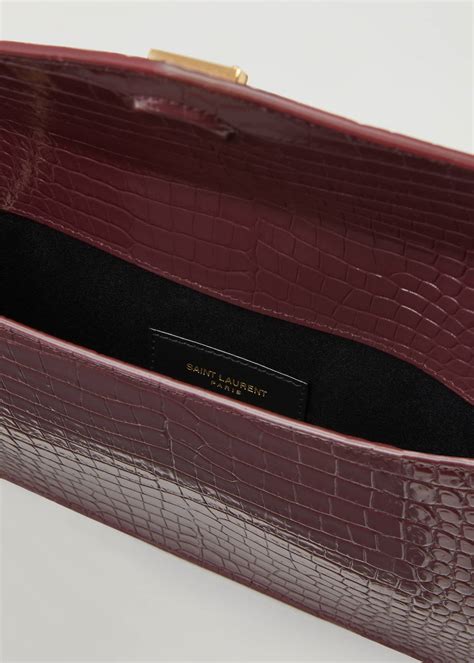 ysl uptown crocodile clutch|st laurent crocodile embossed leather.